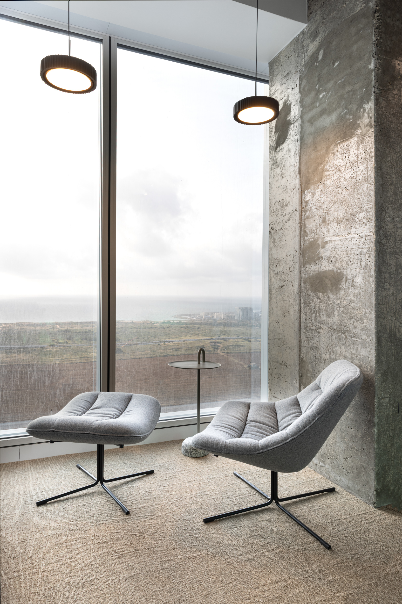 Mishel armchair with stool by Noti